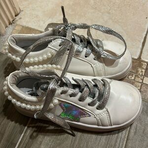 White sneakers with embellishments